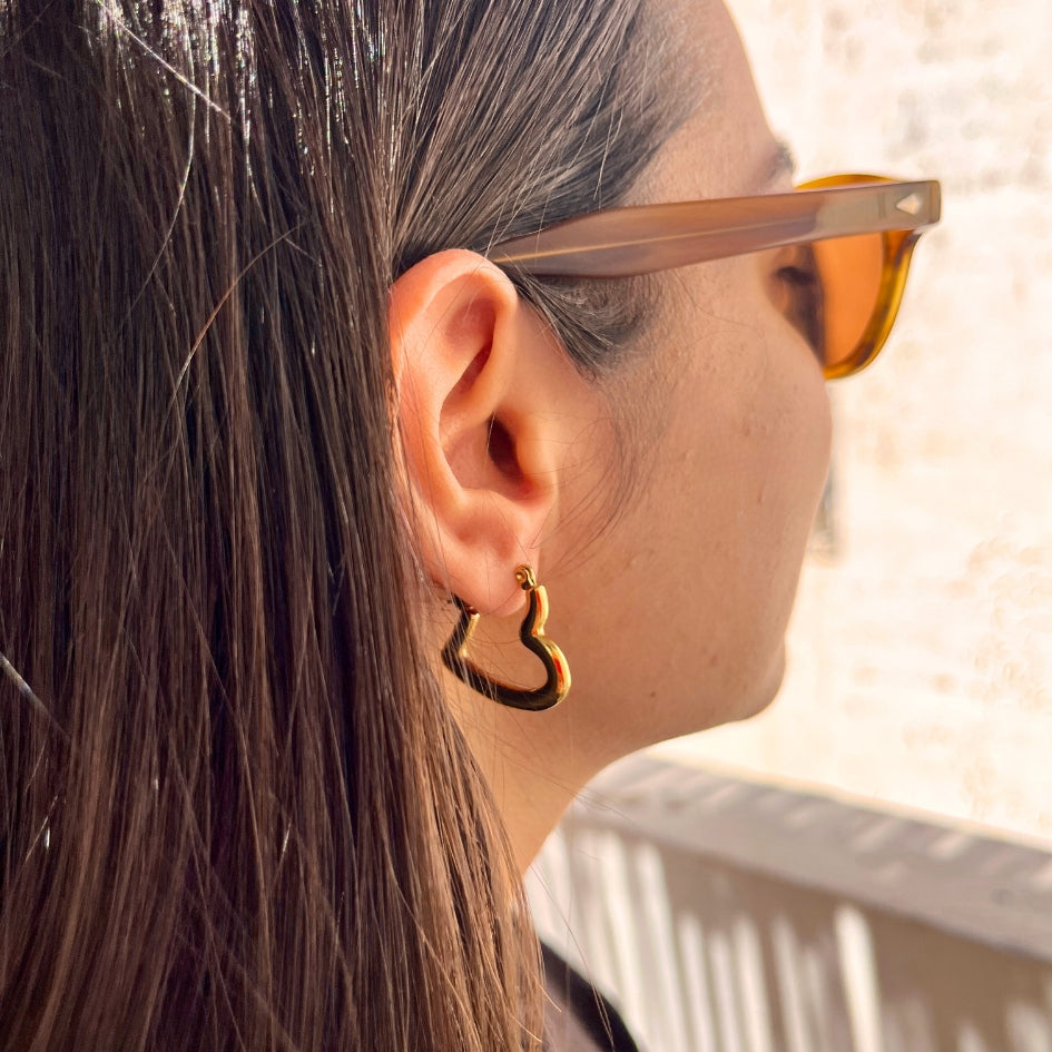 Boucles d’oreilles créoles cœur torsadé doré élégant